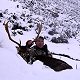 Rodney resting in the snow with his trophy
