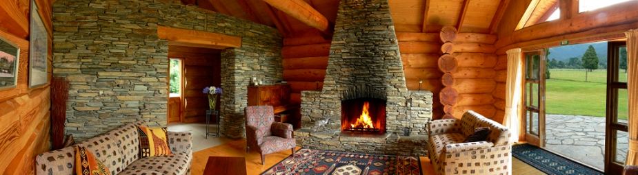 Peel Forest Lodge is a modern log-cabin style lodge with a dramatic stone fireplace in one of the two living areas.